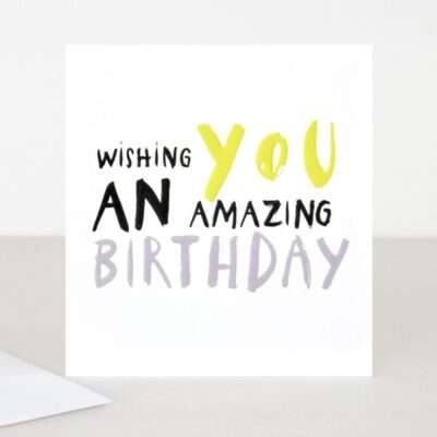 Wishing you an amazing birthday in bold text in black yellow and purple